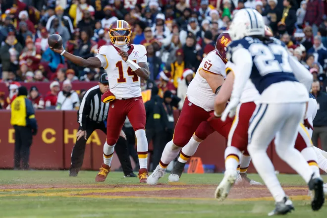 Dec 25, 2025; Landover, Maryland, USA; Washington Commanders quarterback Josh Johnson (14) passes the ball against the Dallas Cowboys in the first half at Northwest Stadium. Mandatory Credit: Amber Searls-Imagn Images