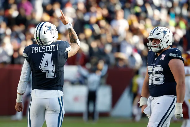 Dec 25, 2025; Landover, Maryland, USA; Dallas Cowboys quarterback Dak Prescott (4) celebrates after a touchdown against the Washington Commanders in the second quarter at Northwest Stadium. Mandatory Credit: Geoff Burke-Imagn Images