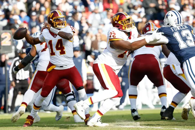 Dec 25, 2025; Landover, Maryland, USA; Washington Commanders quarterback Josh Johnson (14) passes the ball against the Dallas Cowboys in the first quarter at Northwest Stadium. Mandatory Credit: Geoff Burke-Imagn Images