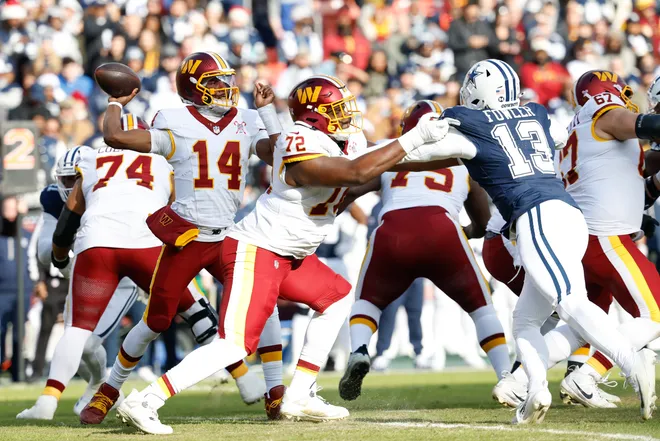 Dec 25, 2025; Landover, Maryland, USA; Washington Commanders quarterback Josh Johnson (14) passes the ball against the Dallas Cowboys in the first quarter at Northwest Stadium. Mandatory Credit: Geoff Burke-Imagn Images