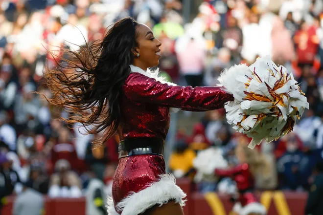 Dec 25, 2025; Landover, Maryland, USA; A Washington Commanders cheerleader performs in the second half between the Washington Commanders and the Dallas Cowboys at Northwest Stadium. Mandatory Credit: Amber Searls-Imagn Images