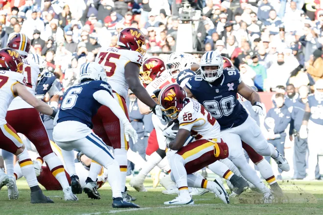 Dec 25, 2025; Landover, Maryland, USA; Washington Commanders running back Jacory Croskey-Merritt (22) carries the ball against the Dallas Cowboys in the second quarter at Northwest Stadium. Mandatory Credit: Geoff Burke-Imagn Images
