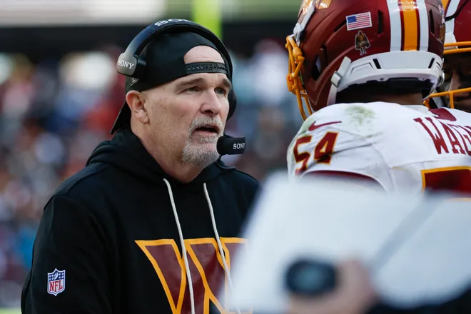 Dec 25, 2025; Landover, Maryland, USA; Washington Commanders head coach Dan Quinn speaks to his players in the second half against the Dallas Cowboys at Northwest Stadium. Mandatory Credit: Amber Searls-Imagn Images