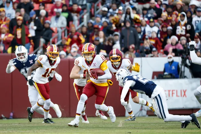 Dec 25, 2025; Landover, Maryland, USA; Washington Commanders wide receiver Chris Moore (19) carries the ball after a reception against the Dallas Cowboys in the third quarter at Northwest Stadium. Mandatory Credit: Amber Searls-Imagn Images