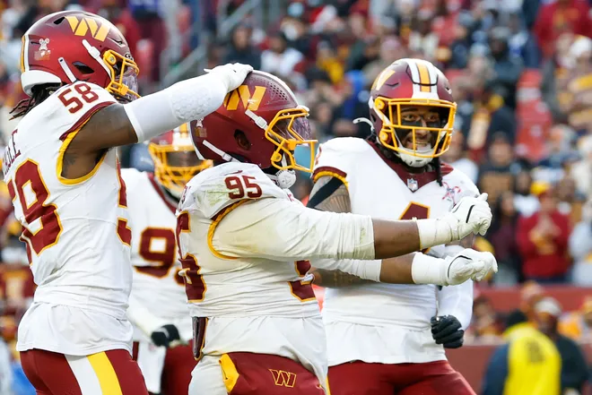 Dec 25, 2025; Landover, Maryland, USA; Washington Commanders defensive tackle Jer'Zhan Newton (95) celebrates after a sack against the Dallas Cowboys in the third quarter at Northwest Stadium. Mandatory Credit: Geoff Burke-Imagn Images