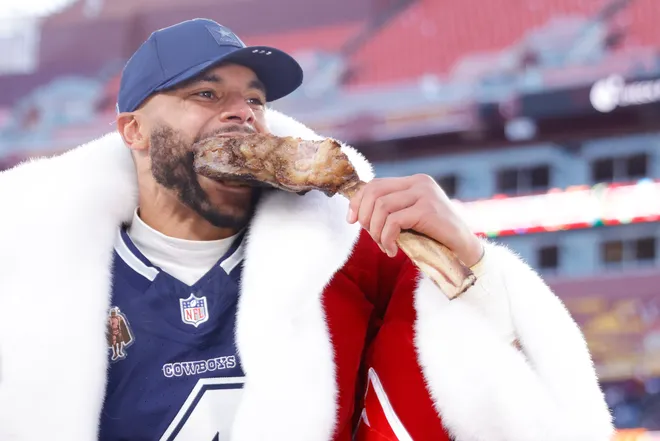 Dec 25, 2025; Landover, Maryland, USA; Dallas Cowboys quarterback Dak Prescott (4) eats a steak after the game against the Washington Commanders at Northwest Stadium. Mandatory Credit: Amber Searls-Imagn Images