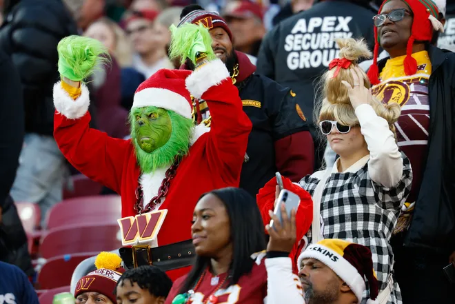 Dec 25, 2025; Landover, Maryland, USA; Fans react in the fourth quarter between the Washington Commanders and the Dallas Cowboys at Northwest Stadium. Mandatory Credit: Geoff Burke-Imagn Images