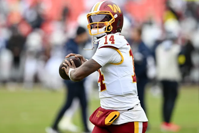 LANDOVER, MARYLAND - DECEMBER 25: Josh Johnson #14 of the Washington Commanders warms up prior to a game against the Dallas Cowboys at Northwest Stadium on December 25, 2025 in Landover, Maryland. (Photo by Greg Fiume/Getty Images)