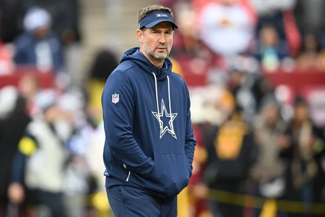 LANDOVER, MARYLAND - DECEMBER 25: Head coach Brian Schottenheimer of the Dallas Cowboys looks on prior to a game against the Washington Commanders at Northwest Stadium on December 25, 2025 in Landover, Maryland. (Photo by Greg Fiume/Getty Images)