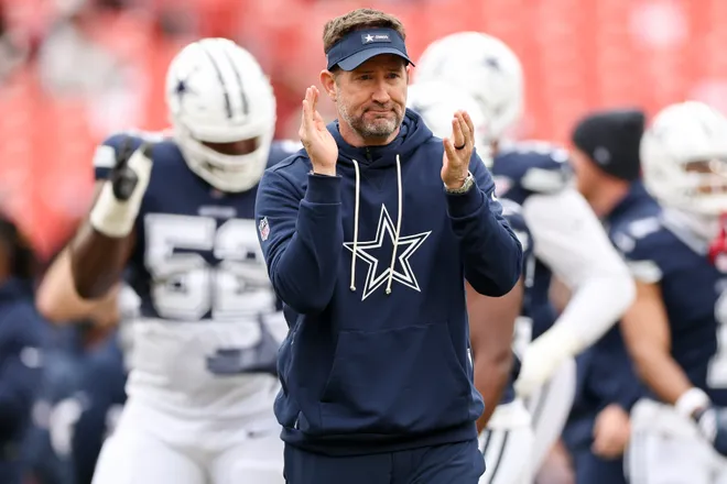 LANDOVER, MARYLAND - DECEMBER 25: Head coach Brian Schottenheimer of the Dallas Cowboys looks on prior to a game against the Washington Commanders at Northwest Stadium on December 25, 2025 in Landover, Maryland. (Photo by Scott Taetsch/Getty Images)