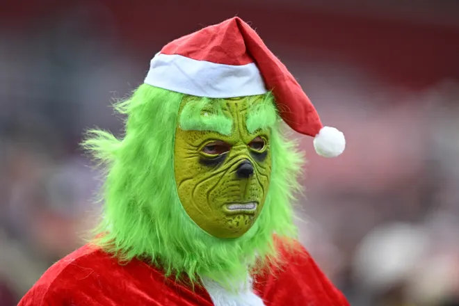LANDOVER, MARYLAND - DECEMBER 25: A fan dressed as The Grinch looks on prior to a game between the Dallas Cowboys and the Washington Commanders at Northwest Stadium on December 25, 2025 in Landover, Maryland. (Photo by Greg Fiume/Getty Images)