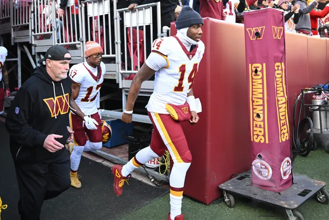 LANDOVER, MARYLAND - DECEMBER 25: Head coach Dan Quinn and Josh Johnson #14 of the Washington Commanders run onto the field prior to a game against the Dallas Cowboys at Northwest Stadium on December 25, 2025 in Landover, Maryland. (Photo by Greg Fiume/Getty Images)