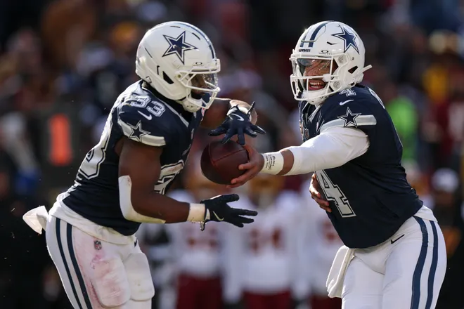 LANDOVER, MARYLAND - DECEMBER 25: Dak Prescott #4 hands the ball off to Javonte Williams #33 of the Dallas Cowboys in the first quarter of a game against the Washington Commanders at Northwest Stadium on December 25, 2025 in Landover, Maryland. (Photo by Scott Taetsch/Getty Images)
