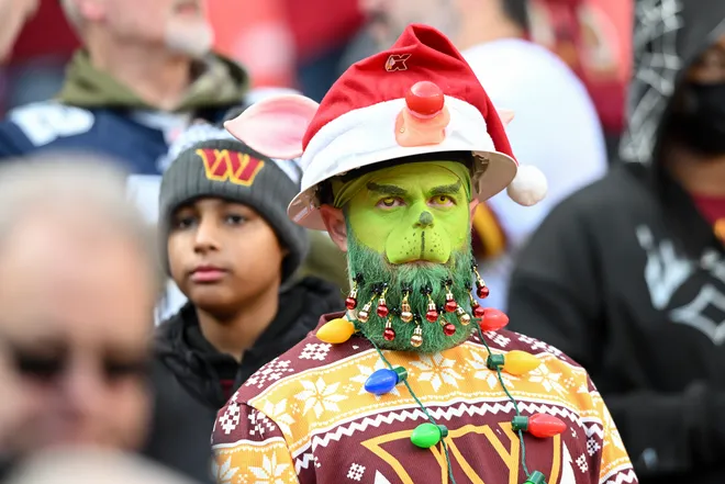 LANDOVER, MARYLAND - DECEMBER 25: A fan dressed as The Grinch looks on prior to a game between the Dallas Cowboys and the Washington Commanders at Northwest Stadium on December 25, 2025 in Landover, Maryland. (Photo by Greg Fiume/Getty Images)