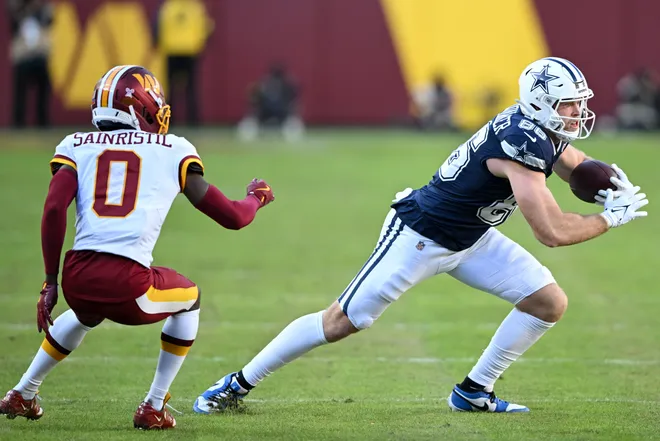 LANDOVER, MARYLAND - DECEMBER 25: Luke Schoonmaker #86 of the Dallas Cowboys catches a pass against Mike Sainristil #0 of the Washington Commanders in the second quarter of a game at Northwest Stadium on December 25, 2025 in Landover, Maryland. (Photo by Greg Fiume/Getty Images)