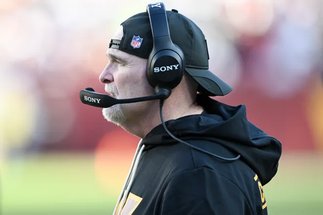 LANDOVER, MARYLAND - DECEMBER 25: Head coach Dan Quinn of the Washington Commanders looks on from the sideline in the second quarter of a game against the Washington Commanders at Northwest Stadium on December 25, 2025 in Landover, Maryland. (Photo by Greg Fiume/Getty Images)