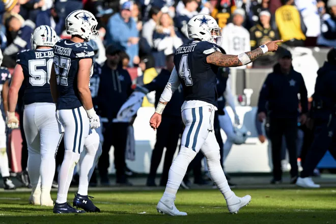 LANDOVER, MARYLAND - DECEMBER 25: Dak Prescott #4 of the Dallas Cowboys reacts after throwing a touchdown pass against the Washington Commanders in the second quarter of a game at Northwest Stadium on December 25, 2025 in Landover, Maryland. (Photo by Greg Fiume/Getty Images)