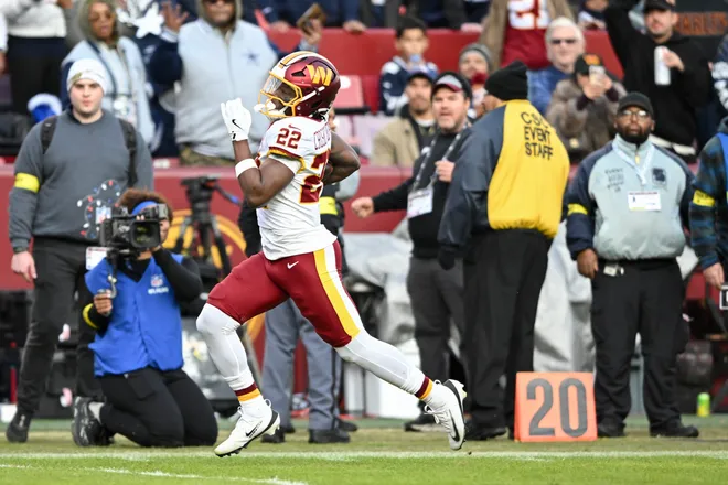 LANDOVER, MARYLAND - DECEMBER 25: Jacory Croskey-Merritt #22 of the Washington Commanders runs the ball against the Dallas Cowboys in the third quarter of a game at Northwest Stadium on December 25, 2025 in Landover, Maryland. (Photo by Greg Fiume/Getty Images)