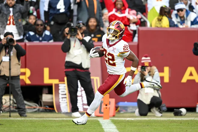 LANDOVER, MARYLAND - DECEMBER 25: Jacory Croskey-Merritt #22 of the Washington Commanders scores a rushing touchdown against the Dallas Cowboys in the third quarter of a game at Northwest Stadium on December 25, 2025 in Landover, Maryland. (Photo by Greg Fiume/Getty Images)
