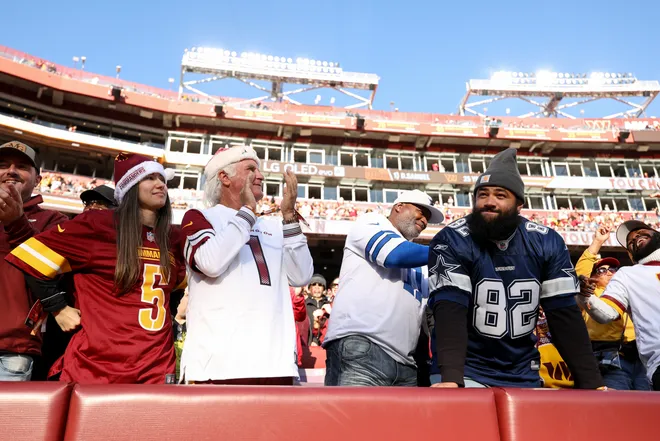 LANDOVER, MARYLAND - DECEMBER 25: Washington Commanders and Dallas Cowboys fans reacts in the second quarter of a game at Northwest Stadium on December 25, 2025 in Landover, Maryland. (Photo by Scott Taetsch/Getty Images)