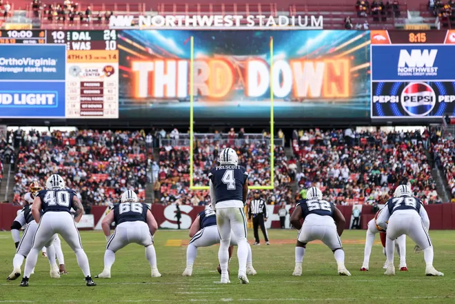 LANDOVER, MARYLAND - DECEMBER 25: Dak Prescott #4 of the Dallas Cowboys calls a play against the Washington Commanders in the third quarter of a game at Northwest Stadium on December 25, 2025 in Landover, Maryland. (Photo by Scott Taetsch/Getty Images)