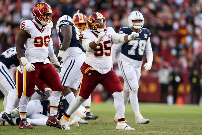 LANDOVER, MARYLAND - DECEMBER 25: Jer'Zhan Newton #95 of the Washington Commanders celebrates after a sack against the Dallas Cowboys in the third quarter of a game at Northwest Stadium on December 25, 2025 in Landover, Maryland. (Photo by Scott Taetsch/Getty Images)