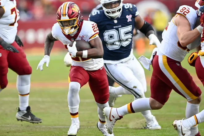 LANDOVER, MARYLAND - DECEMBER 25: Jacory Croskey-Merritt #22 of the Washington Commanders runs the ball against the Dallas Cowboys in the third quarter of a game at Northwest Stadium on December 25, 2025 in Landover, Maryland. (Photo by Greg Fiume/Getty Images)