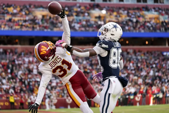 LANDOVER, MARYLAND - DECEMBER 25: Jonathan Jones #31 of the Washington Commanders breaks up a pass intended for Ceedee Lamb #88 of the Dallas Cowboys in the third quarter of a game at Northwest Stadium on December 25, 2025 in Landover, Maryland. (Photo by Scott Taetsch/Getty Images)