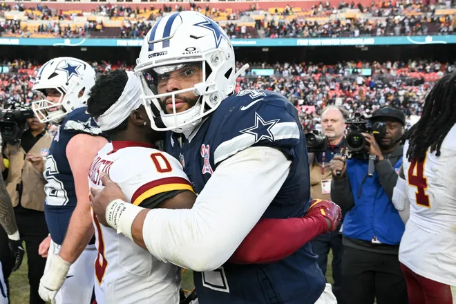 LANDOVER, MARYLAND - DECEMBER 25: Mike Sainristil #0 of the Washington Commanders and Dak Prescott #4 of the Dallas Cowboys after Dallas' 30-23 victory at Northwest Stadium on December 25, 2025 in Landover, Maryland. (Photo by Greg Fiume/Getty Images)