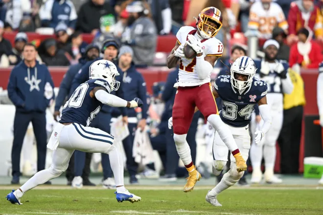 LANDOVER, MARYLAND - DECEMBER 25: Terry McLaurin #17 of the Washington Commanders catches a pass against Shavon Revel Jr. #34 of the Dallas Cowboys in the fourth quarter of a game at Northwest Stadium on December 25, 2025 in Landover, Maryland. (Photo by Greg Fiume/Getty Images)