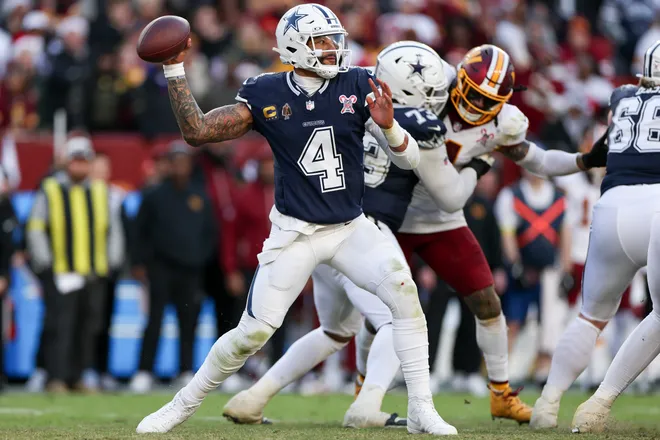 LANDOVER, MARYLAND - DECEMBER 25: Dak Prescott #4 of the Dallas Cowboys looks to pass in the fourth quarter of a game against the Washington Commanders at Northwest Stadium on December 25, 2025 in Landover, Maryland. (Photo by Scott Taetsch/Getty Images)