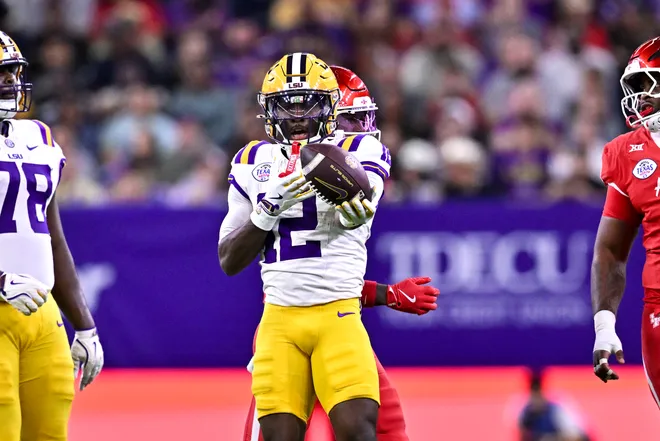 Dec 27, 2025; Houston, TX, USA; Louisiana State Tigers wide receiver Kyle Parker (12) motions during the first half against the Houston Cougars at NRG Stadium. Mandatory Credit: Maria Lysaker-Imagn Images