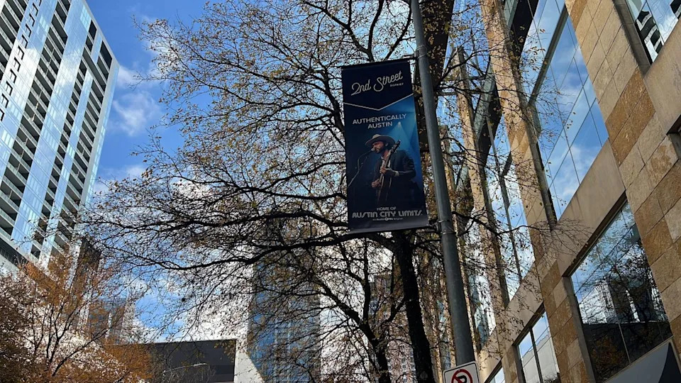 A banner of Shakey Graves was installed in downtown Austin’s 2nd Street District. Several banners in the area showcase iconic Austin and Texas performers who have performed on Austin PBS’s Austin City Limits. (KXAN Photo/Abigail Jones)