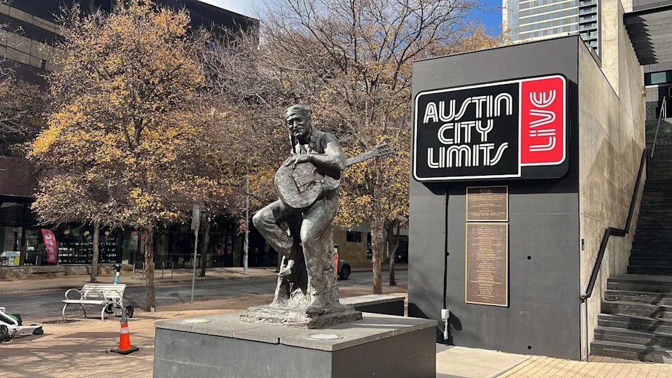 A statue of Willie Nelson sits in front of ACL Live at the Moody Theater in downtown Austin on 2nd Street, also known as “Willie Nelson Boulevard.” (KXAN Photo/Abigail Jones)