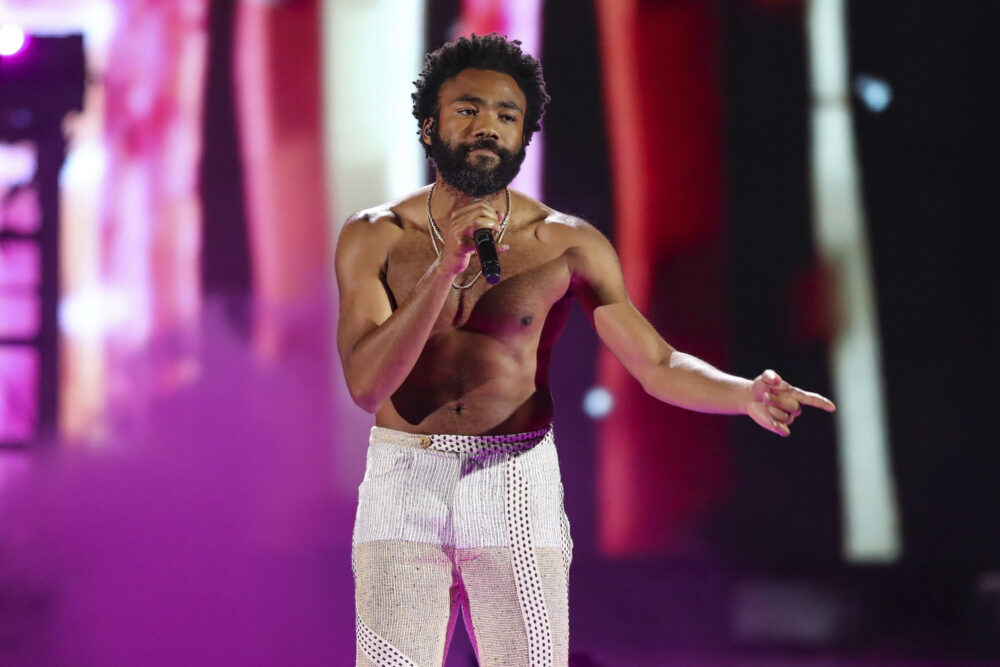 FILE - In this Friday, Sept. 21, 2018 file photo, Childish Gambino performs at the 2018 iHeartRadio Music Festival Day 1 held at T-Mobile Arena in Las Vegas. Hip-hop has been an integral part of social and racial justice movements.It's also been scrutinized by law enforcement and political groups because of their belief that hip-hop and its artists' encourage violent criminality. Free speech advocates see the ongoing persecution of rappers as a proxy war primarily waged against Black and Latino people who are the early pioneers of the culture. His hit 