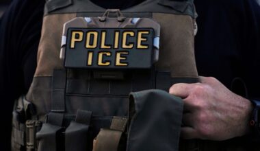 A U.S. Immigration and Customs Enforcement agent is seen in Park Ridge, Ill., Sept. 19, 2025. (AP Photo/Erin Hooley)