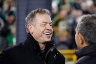 Former football quarterback Troy Aikman on field before an NFL football game between the...