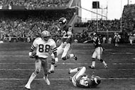 Drew Pearson catches Roger Staubach's Hail Mary pass in an NFL playoff game against the...