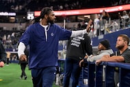 Dallas Cowboys cornerback Trevon Diggs waves goodbye as he walks off the field after an NFL...