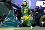 Oregon running back Dierre Hill Jr. (23) celebrates his touchdown during the first half of the first round of the NCAA College Football Playoff against James Madison, Saturday, Dec. 20, 2025, in Eugene, Ore.
