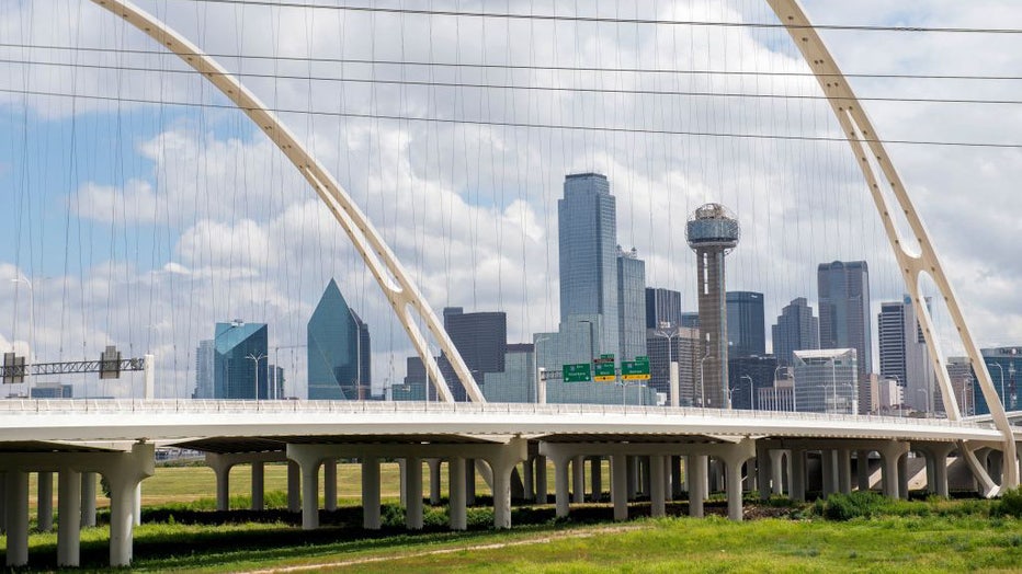 FILE - View of the Dallas skyline through the Horseshoe highway built to upgrade the congested interchange in downtown Dallas, Texas, on July 21, 2020. (Photo by VALERIE MACON/AFP via Getty Images)