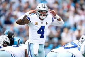Dak Prescott signals before the snap during the Dallas Cowboys vs. Washington Commanders Week 7 NFL game.