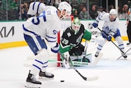 Dallas Stars goaltender Jake Oettinger (29) defends the goal against Toronto Maple Leafs...
