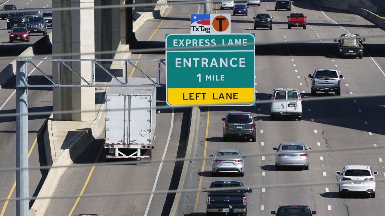 Drivers make their way on an a split highway in Irving, Texas, Friday, March 3, 2023.