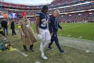 Dallas Cowboys cornerback Shavon Revel is assisted after being injured during the second...