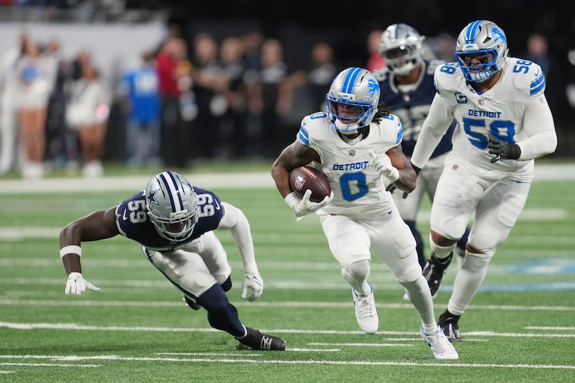 Detroit Lions running back Jahmyr Gibbs (0) runs the ball as Dallas Cowboys linebacker Jr....