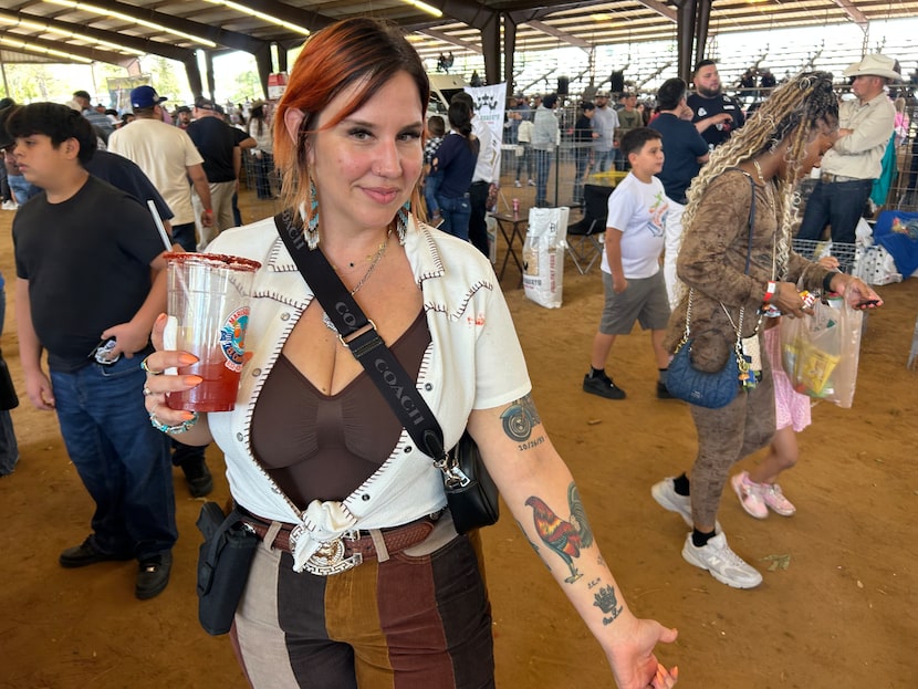 Katalina Carvente, founder of El Gallo Show Worldwide, shows her rooster tattoo at the Nov....