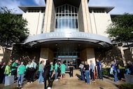 People wait outside Fairview City Hall for a meeting discussing the Fairview Texas Temple at...