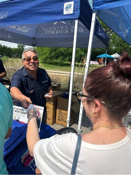 Handing out Fiesta Medals at the River Authority’s Fiesta Flotilla Event