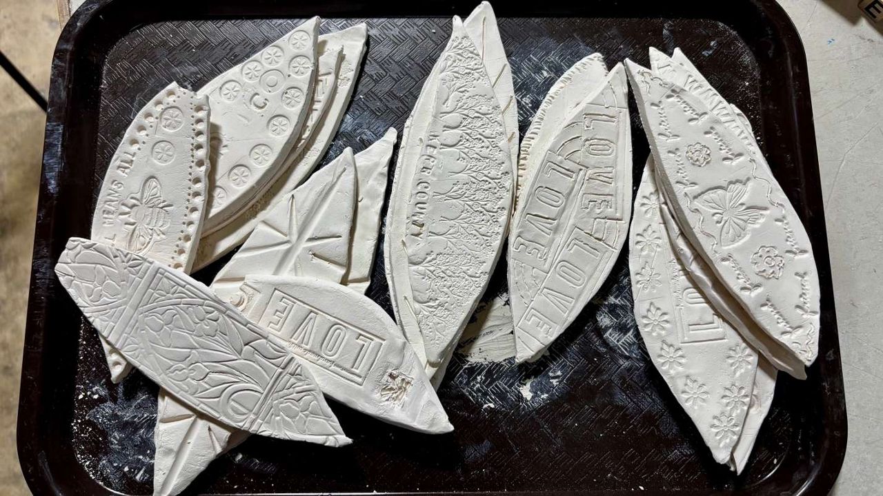 Some of the mosaic tiles to be featured in the mural honoring the lives lost in the Kerr County floods. (Spectrum News 1/Hannah Maguire)